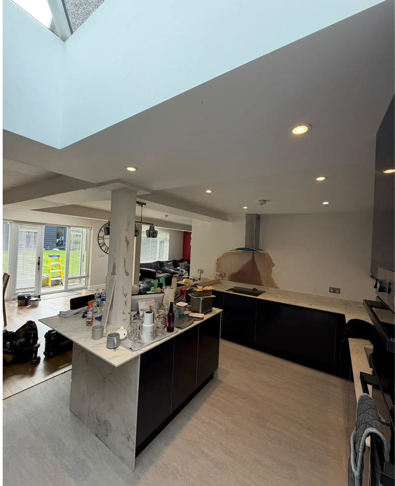 Kitchen renovation with illuminated ceiling downlights and a roof window