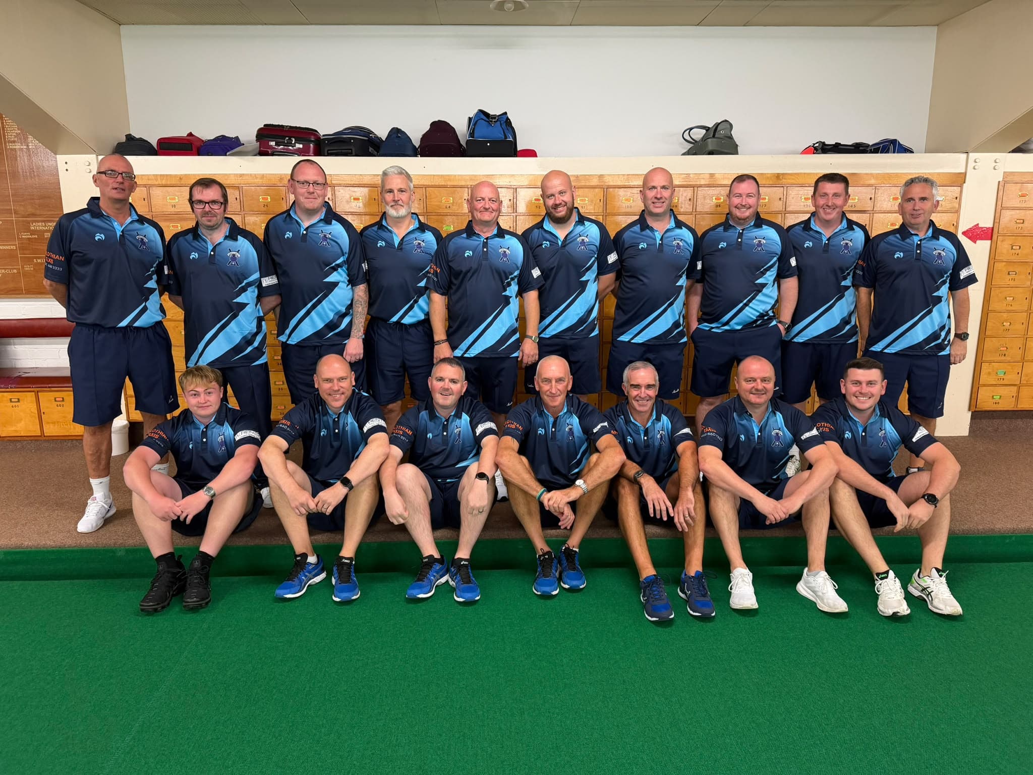 Midlothian Indoor Bowling Club players standing and seated together in their new strips